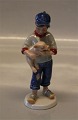 B&G Figurine B&G 2003 Year figurine Farmer boy with piglet 14 cm
