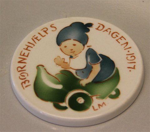 1917 a Girl with green trolly Louis Moe Aluminia Royal Copenhagen faience 
Children Days plates