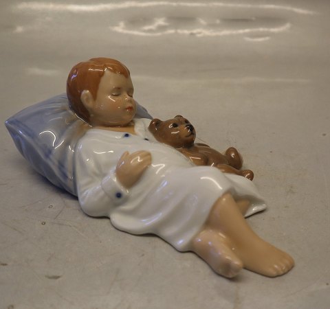 0681 RC Jens sleeping, Boy sleeping with teddy, 6 x 11 cm (1021681) Allan 
Therkelsen Royal Copenhagen 
