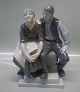 Royal Copenhagen 
2168 RC Man and woman on bench Chr. Thomsen 1921 24 cm